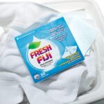 Box of Fresh Fiji Detergent Sheets on a pile of white towels