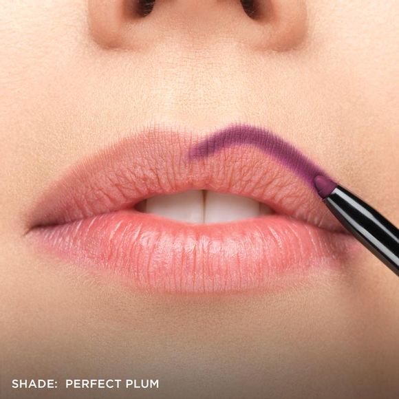 applying plum lip liner