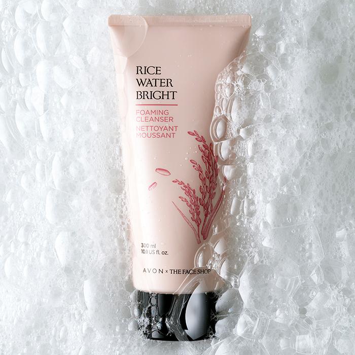 Rice Water Bright Foaming Cleanser surrounded by bubbles