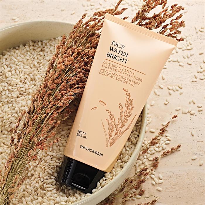 Rice Water Bright Gentle Exfoliating Cleanser in a bowl of rice bran